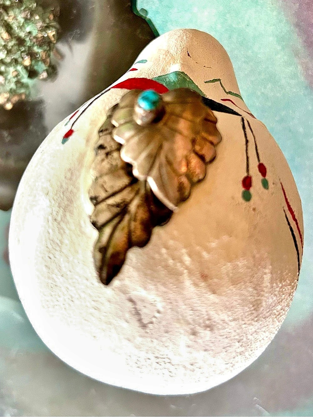 Hand painted southwestern gourd with stone and sterling charm. From New Mexico.